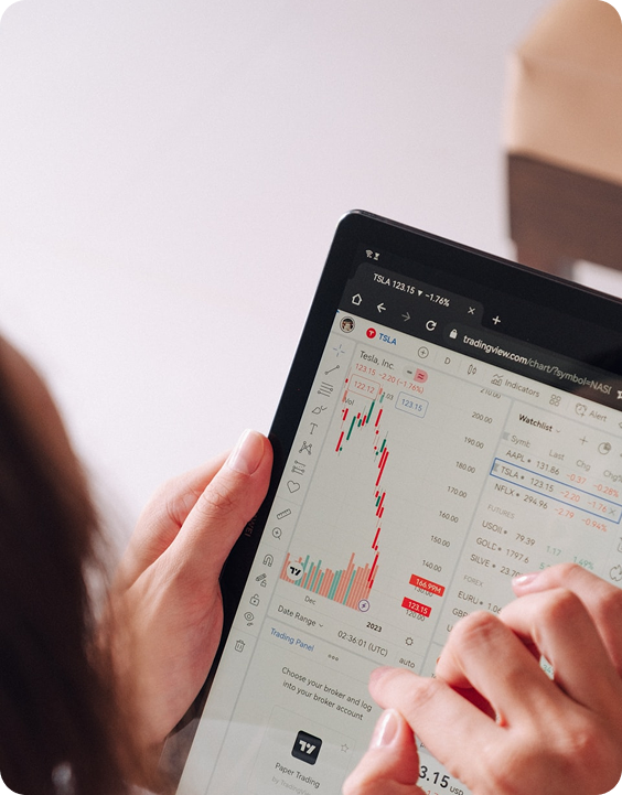 Person using tablet with trading interface